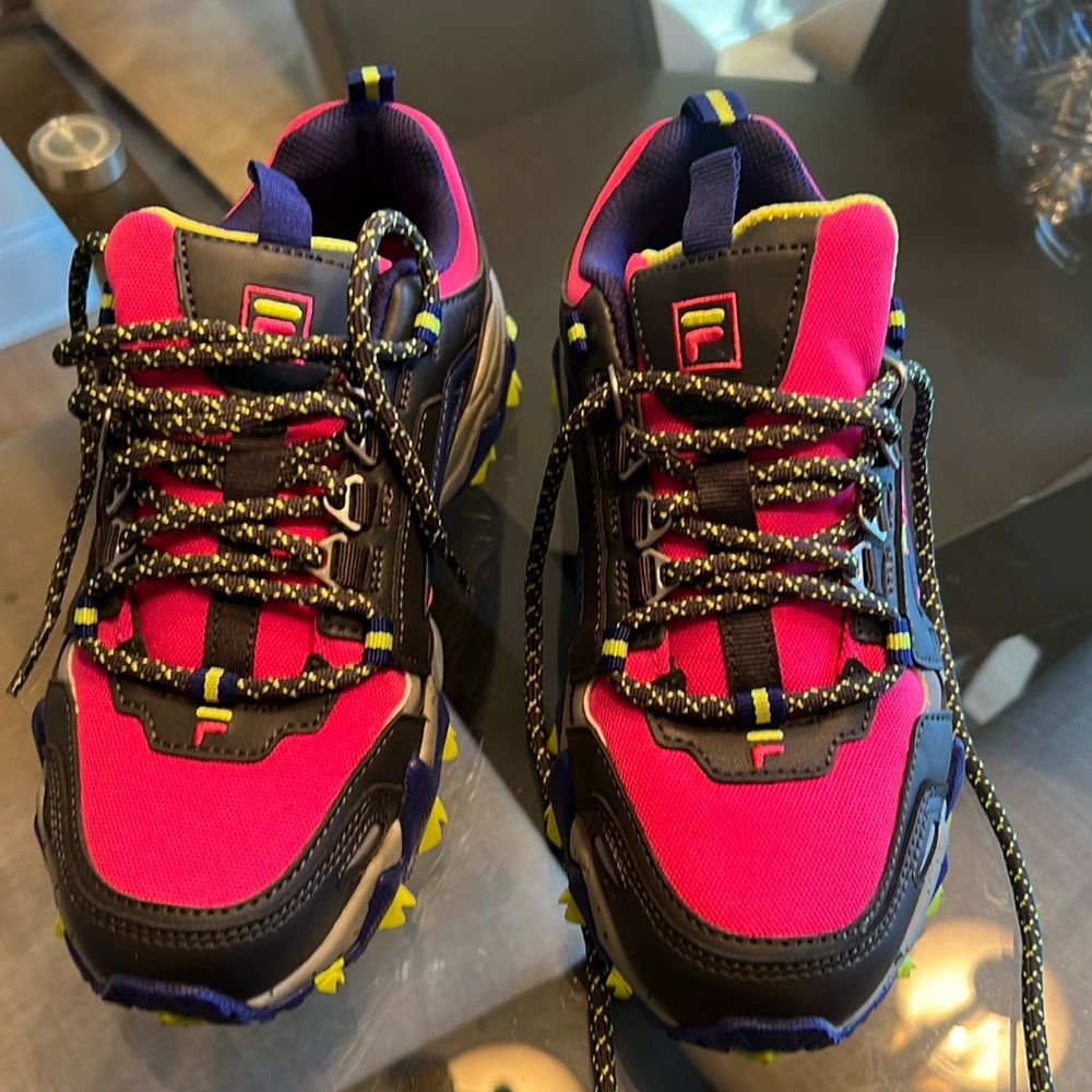 Fila it could be a runny shoes, colors, pink gray, purple green, and size 6